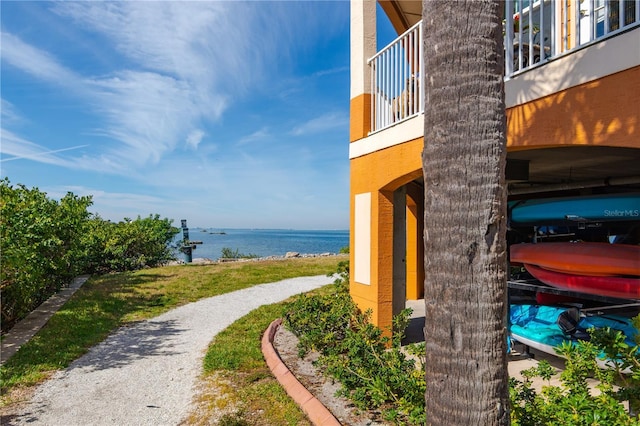 view of home's community with a water view