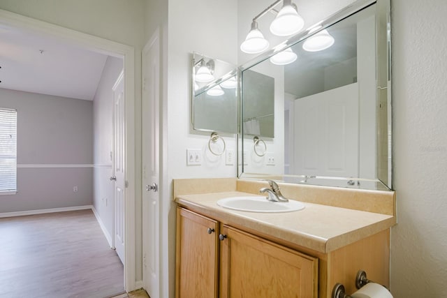 bathroom featuring vanity and baseboards