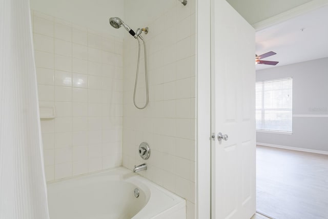 bathroom featuring shower / bathtub combination and ceiling fan