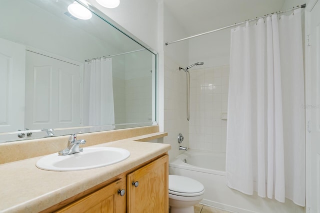 bathroom featuring toilet, shower / bath combo with shower curtain, and vanity