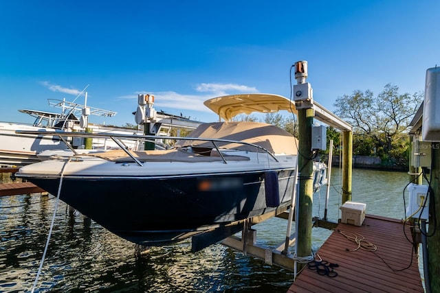 view of dock featuring a water view and boat lift