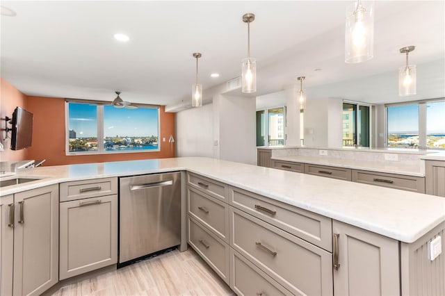 kitchen featuring pendant lighting, ceiling fan, gray cabinets, and dishwasher