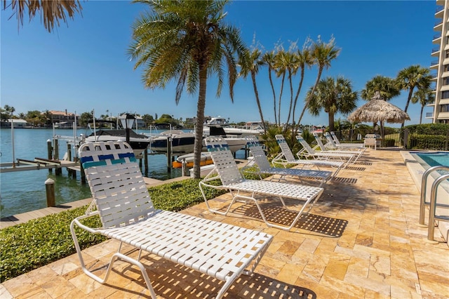 view of patio / terrace featuring a dock and a water view