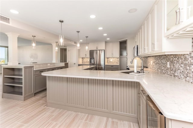736 Island Way Unit 606, Clearwater Beach, FL 33767 - kitchen with appliances with stainless steel finishes, a peninsula, a sink, tasteful backsplash, and recessed lighting
