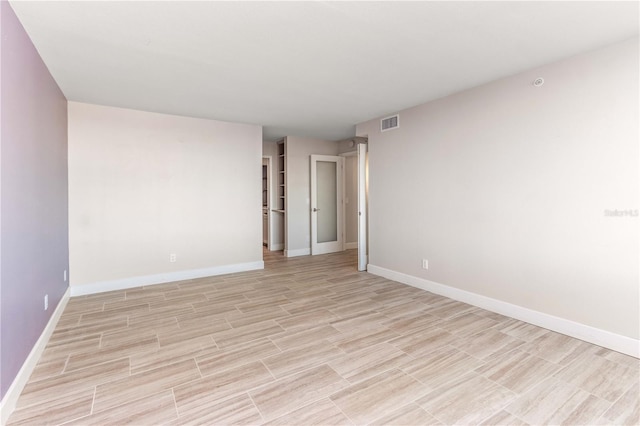 736 Island Way Unit 606, Clearwater Beach, FL 33767 - unfurnished room with baseboards and light wood-type flooring