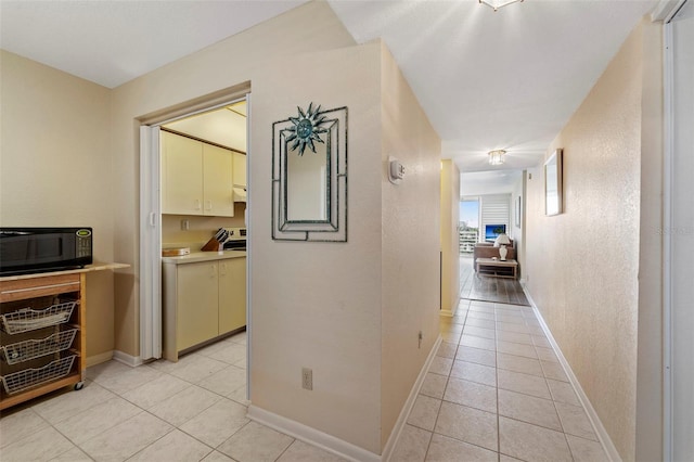 corridor with light tile patterned floors