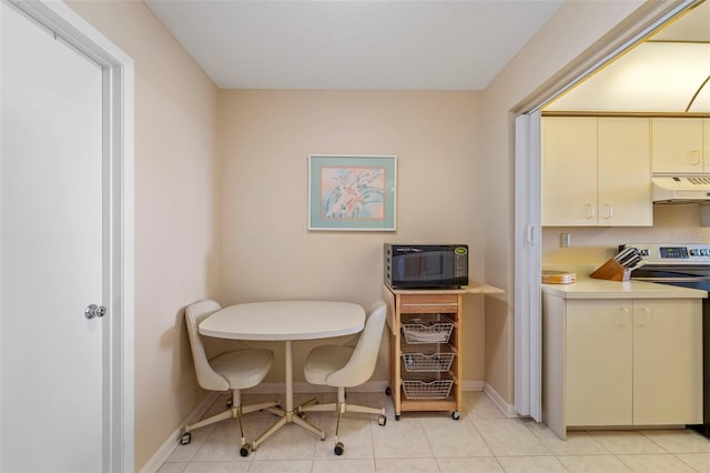 dining area with light tile patterned flooring