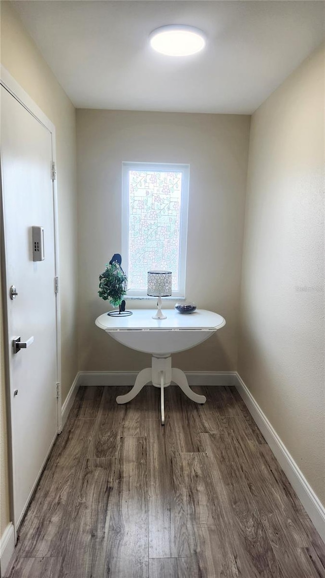 unfurnished dining area with dark hardwood / wood-style floors