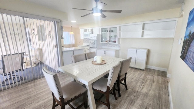 dining room featuring ceiling fan and light hardwood / wood-style floors