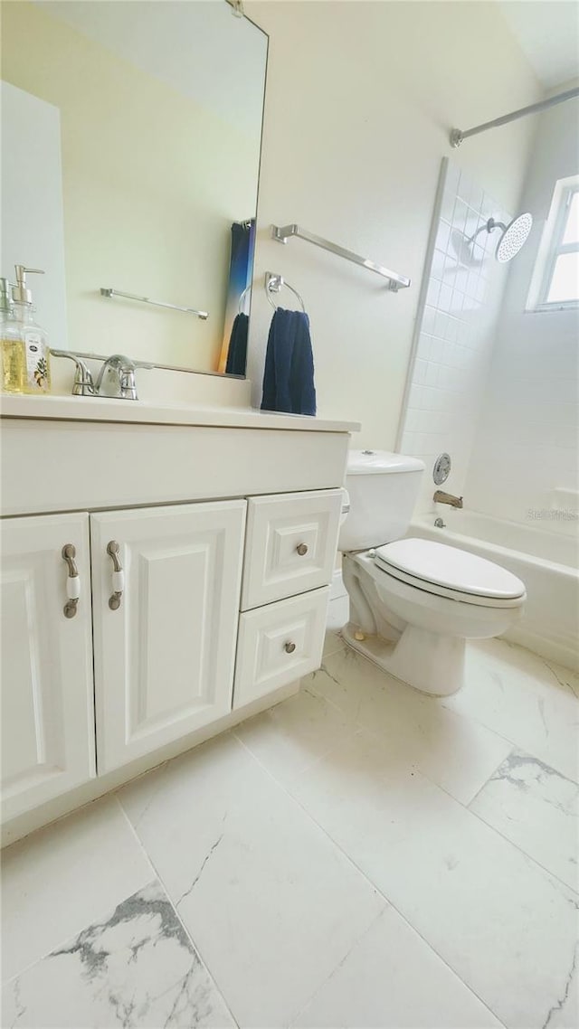 full bathroom with vanity, toilet, and tiled shower / bath