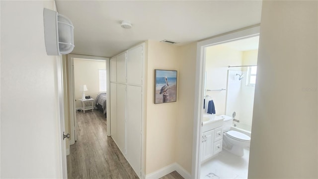 hallway featuring light wood-type flooring