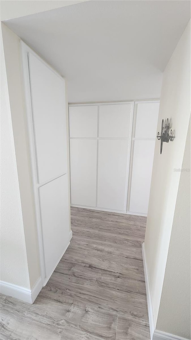 hallway featuring light wood-type flooring