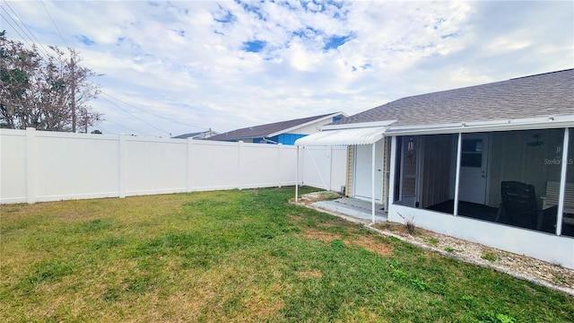 view of yard featuring a sunroom