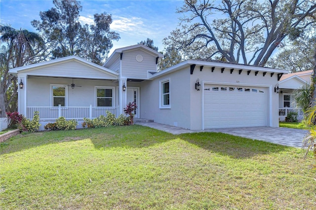 view of front facade featuring a porch, a garage, and a front lawn