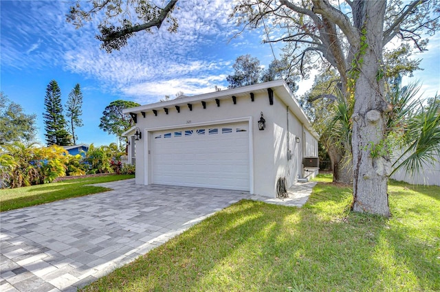 exterior space featuring a front yard and a garage