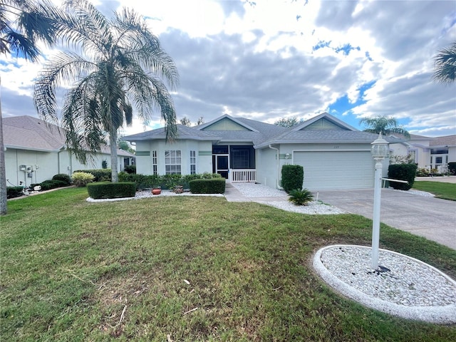 single story home with a garage and a front yard