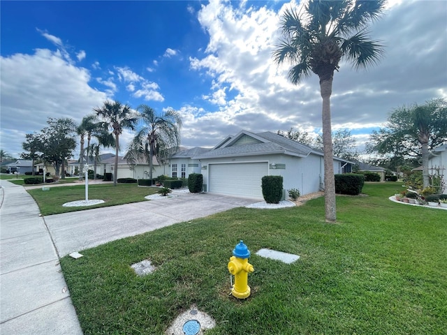 view of side of property featuring a garage and a yard