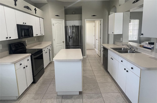 kitchen with white cabinets, sink, and black appliances