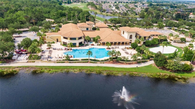 birds eye view of property with a water view