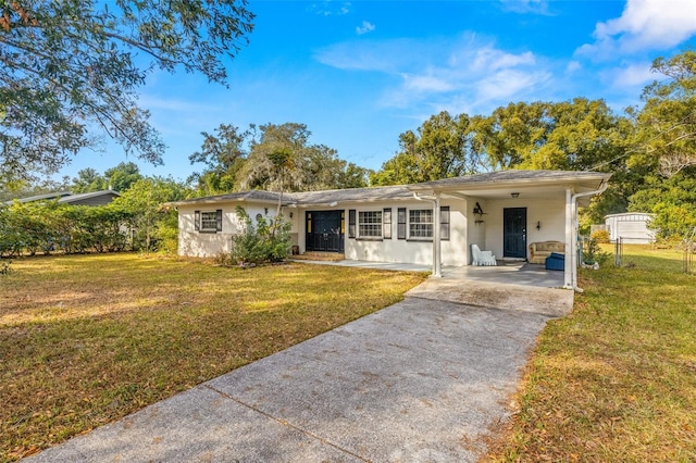 ranch-style house with a carport and a front yard