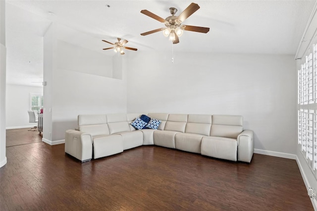 living room featuring ceiling fan, dark hardwood / wood-style flooring, and lofted ceiling