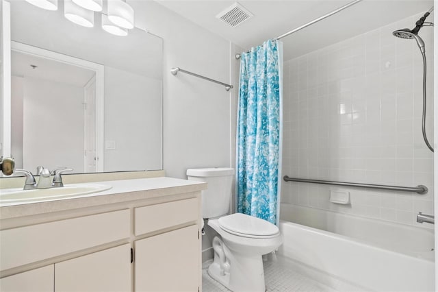 full bathroom featuring tile patterned floors, shower / tub combo with curtain, vanity, and toilet