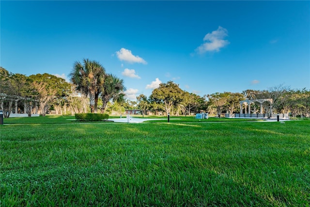 view of home's community with a lawn