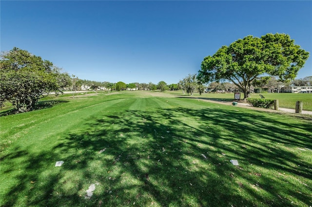 view of property's community with a lawn