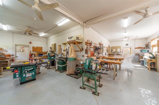 garage featuring a workshop area and ceiling fan