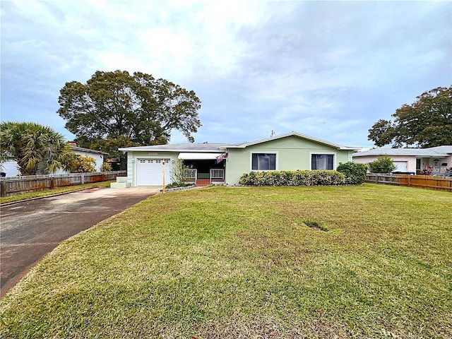 ranch-style home with a front lawn and a garage