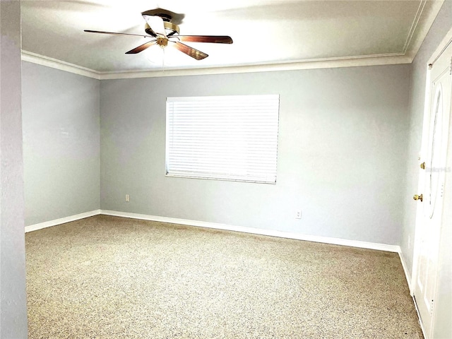 spare room with ceiling fan and crown molding