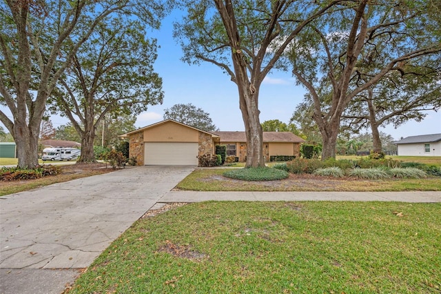 single story home with a garage and a front yard