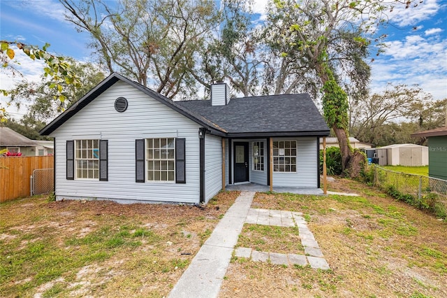 bungalow-style house featuring a front lawn