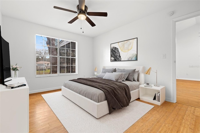 bedroom with ceiling fan and hardwood / wood-style floors