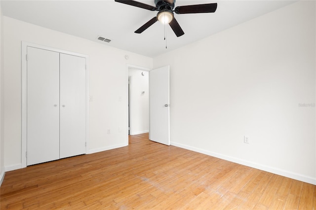 unfurnished bedroom featuring a closet, ceiling fan, and light hardwood / wood-style flooring