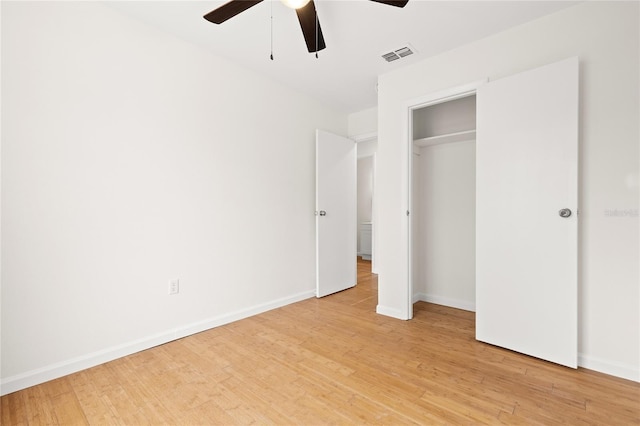 unfurnished bedroom with ceiling fan, a closet, and light hardwood / wood-style flooring