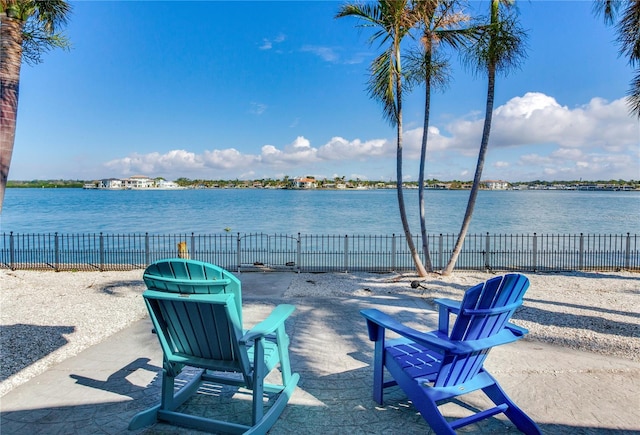 view of patio with a water view