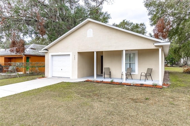 view of front of home with a porch, a garage, and a front lawn