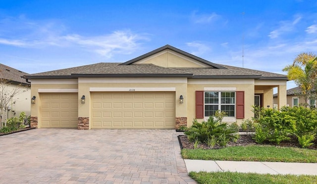 prairie-style home featuring a garage