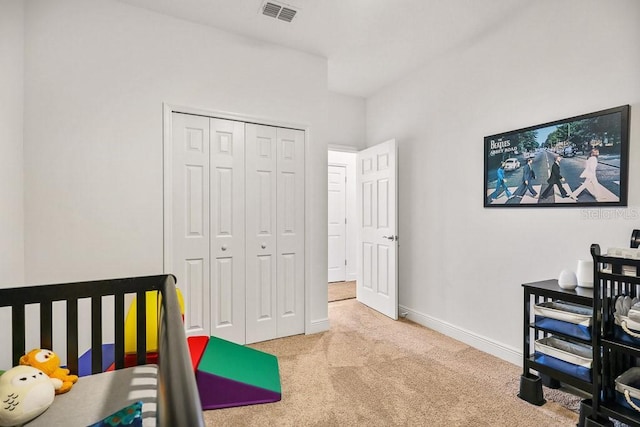 carpeted bedroom featuring a closet