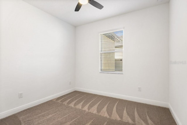 empty room with carpet flooring and ceiling fan