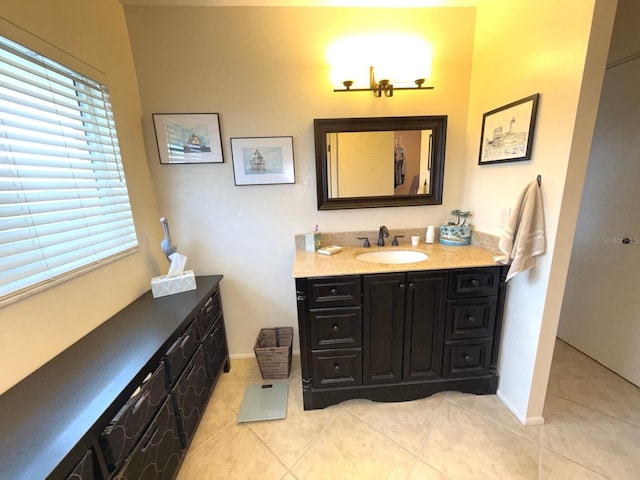 bathroom with tile patterned flooring and vanity