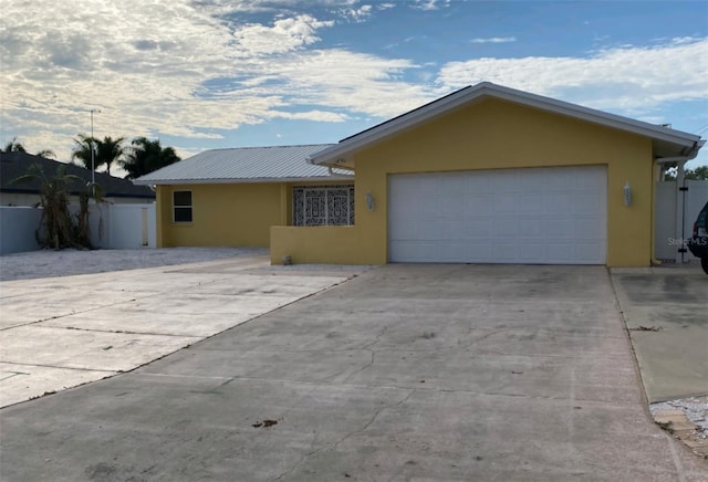 ranch-style house featuring a garage