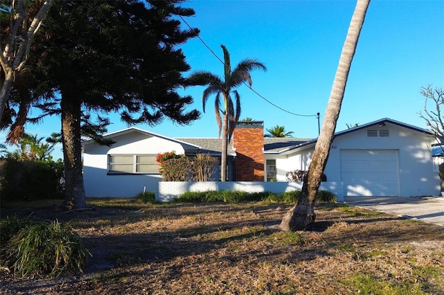 single story home featuring a garage