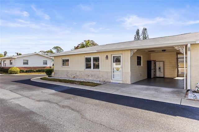 single story home with a carport