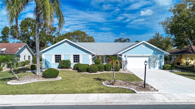 ranch-style house with a garage and a front lawn