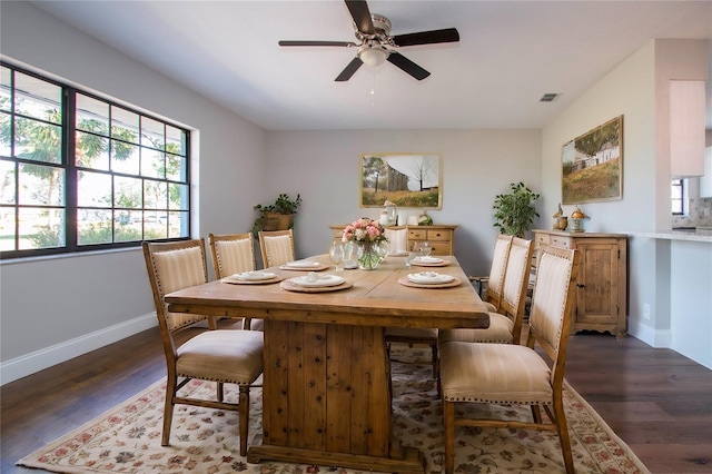 dining room featuring ceiling fan and dark hardwood / wood-style floors