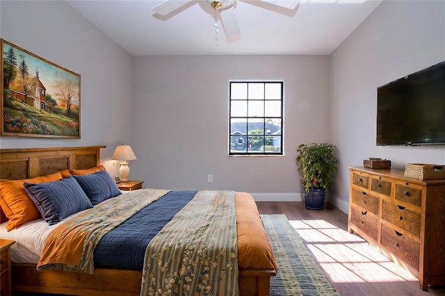 bedroom featuring ceiling fan and light hardwood / wood-style flooring