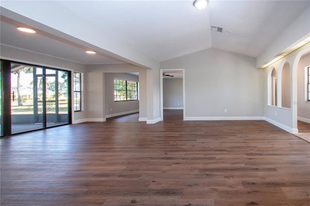 spare room with ceiling fan, dark hardwood / wood-style flooring, and lofted ceiling