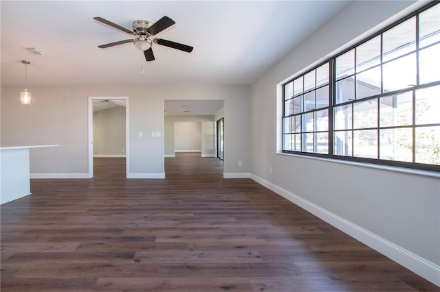 empty room featuring dark hardwood / wood-style floors and ceiling fan